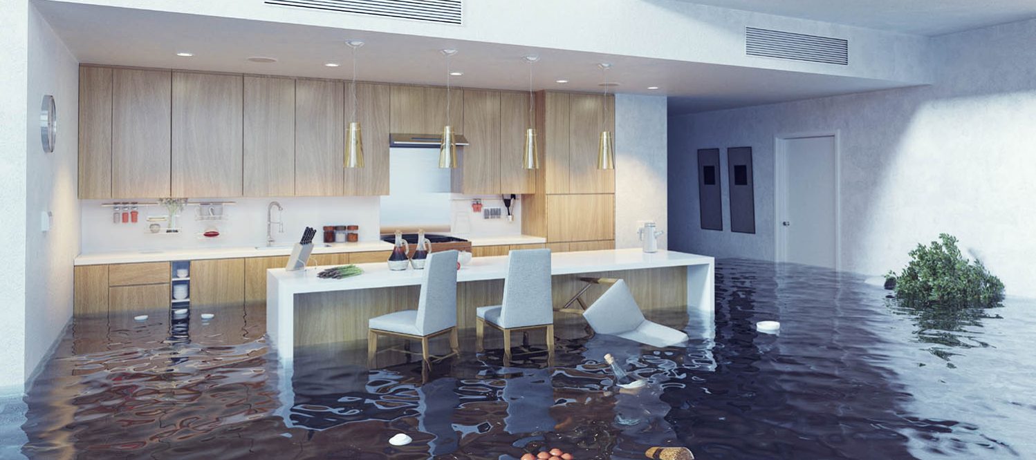 Flooded modern kitchen, water rising almost halfway up the walls.